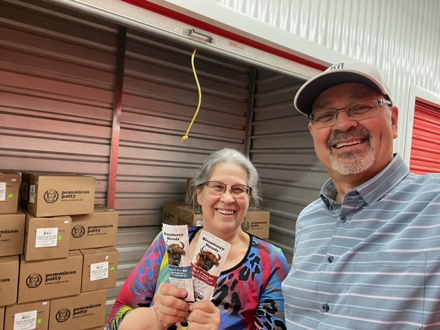 Pemmican Patty founders Patt and Mike at a storage facility storing 8,000 bars