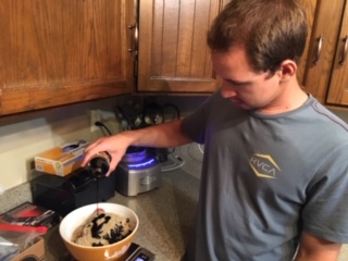 Micah one of Pemmican Patty's founders crafting the first batch of bars suitable for USDA certified manufacturing